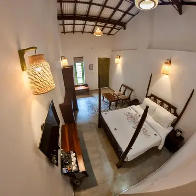 an aerial view of a bedroom with a bed at Welbeck Vintage By Oxygen Resorts in Ooty