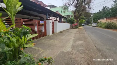 an empty street with a building on the side of the road at SHI's Alaya 3BHk Villa in Coimbatore, near Railway station in Pīlamedu