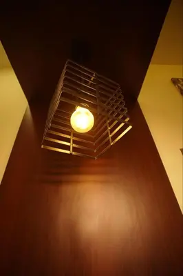 a light on a ceiling in a room at Pabis luxurious stay in Vythiri