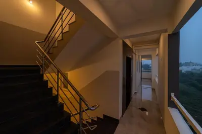 a staircase in a house with a view at Fortune Inn in Erode
