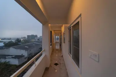a hallway of a building with a view of a city at Fortune Inn in Erode