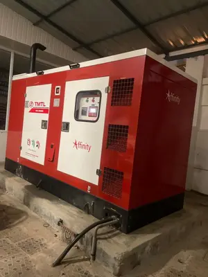 a red and white machine sitting in a building at MEDURE International in Kottakkal