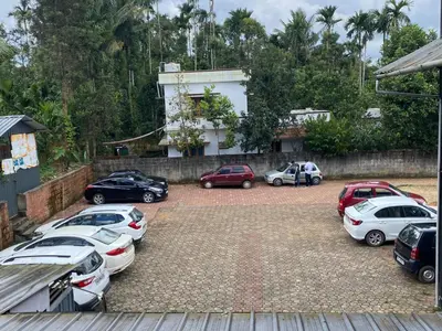 a group of cars parked in a parking lot at LOYAL RESIDENCY in Sultan Bathery
