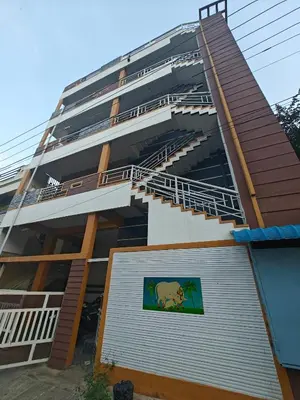 a building with a lion painted on the side of it at 2Bhk holiday home in Mysore
