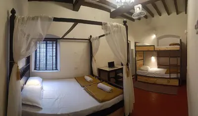 a bedroom with two bunk beds and a window at xplorest in Mysore