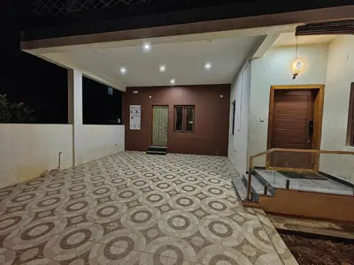 an empty lobby with a staircase and a door at Beautiful 4bhk Duplex Villa in Mysore