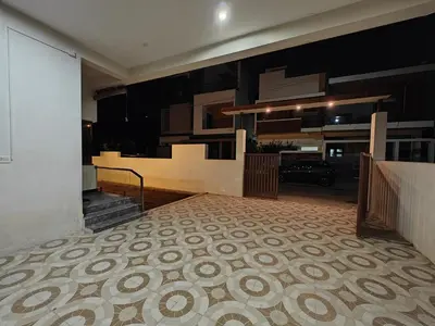 a room with a kitchen and a hallway with a floor at Beautiful 4bhk Duplex Villa in Mysore