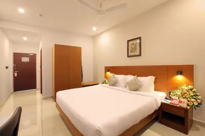a bedroom with a large bed in a room at HOTEL PRINCE in Kāladi