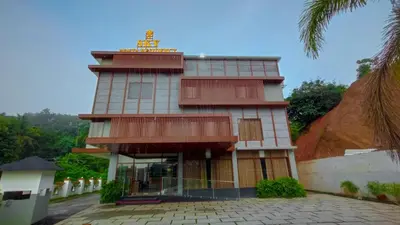 a building with a tower on top of it at SKY PENTA RESIDENCY in Iritti