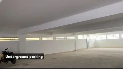 an empty room with a motorcycle parked in it at New Thai Residency in Dhārāpuram
