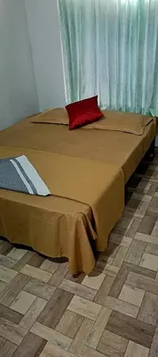 two beds sitting next to each other in a room at JJ HOLIDAY HOMES WAYANAD in Kalpetta