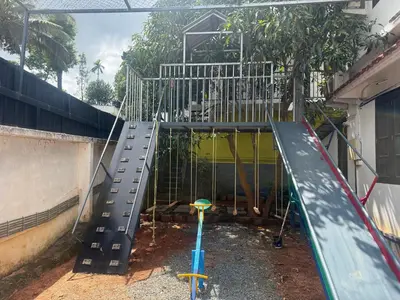 a playground with a slide in a building at Empire Private Pool Villa in Kalpetta