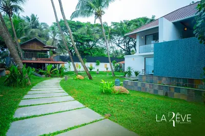 a walkway in front of a house at LA RÊVE The Beach Villa in Malappuram