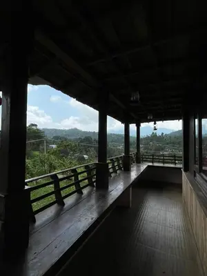 a view from the inside of a building with a balcony at Vythiri Palace Wayanad Pool Resort - Mist Climate & India's First Apple Infinity Pool in Vythiri