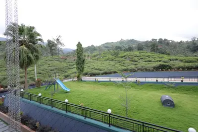 a playground with a slide in a park at jungle view resort in Mananthavady