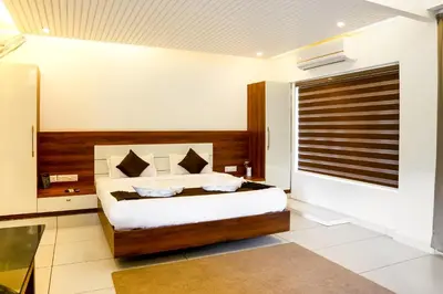 a bedroom with a bed in a room at jungle view resort in Mananthavady