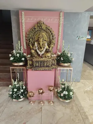 a shrine with a gold lion on top of it at Hotel Mangala Temple View in Guruvāyūr