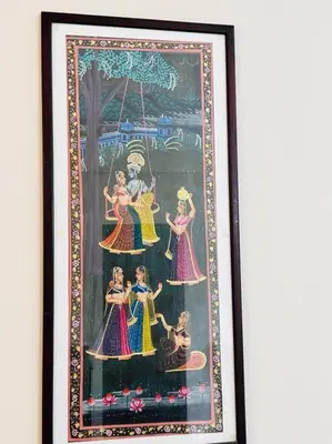 a framed picture of a painting of dancers at Soorya Madhavam Apartment Guruvayur - 200 m from temple walkable in Guruvāyūr