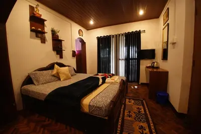a bedroom with a large bed in a room at The Green Casa By Green leaves -Families Only in Ooty