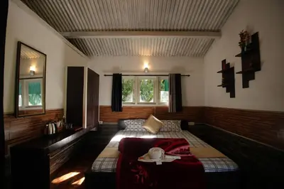 a bedroom with a bed and a large window at The Green Casa By Green leaves -Families Only in Ooty