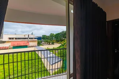 a balcony with a view of a building at Sancta Maria Airport Hotel in Cochin