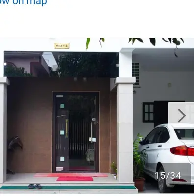 a white car parked in front of a house at Niks homestay B in Trichūr