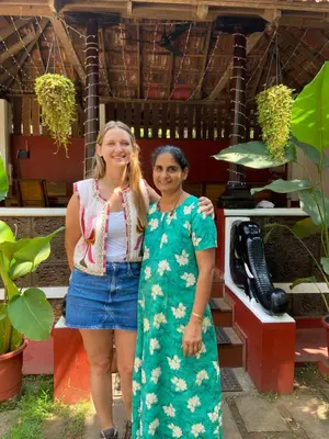 two women are standing in front of a store at Dove cottage in Cherai Beach