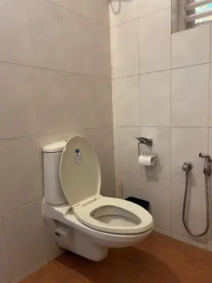 a bathroom with a toilet and a shower at Raaga on the Beach in Kannur