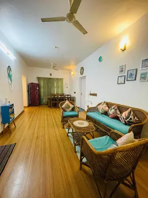 a living room with a couch and chairs at Raaga on the Beach in Kannur