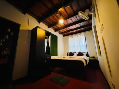a small bedroom with a bed and a window at Paroommel Haven Wayanad in Kenichira