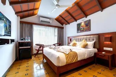 a bedroom with a large bed in a room at Palcastle Regency in Palakkad