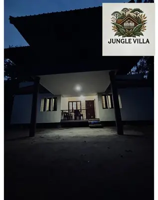 a building with a sign that reads jungle villa at 4 Bedroom Jungle Villa in Panamaram