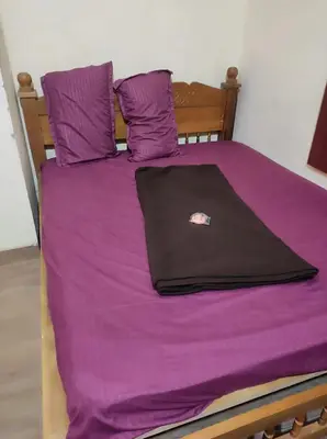 a laptop computer sitting on top of a bed at 4 Bedroom Jungle Villa in Panamaram