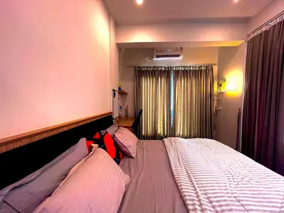 a bedroom with a large bed with pillows at Green Horizon, Luxury & Nature at Kothamangalam in Kotamangalam