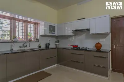 a kitchen with a sink and a counter top at StayVista at Nature Nook with Pvt Pool & Terrace Access in Trichūr