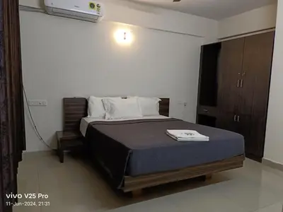 a bedroom with a bed in a room at VVP serviceapartments cochin Airport in Nedumbassery