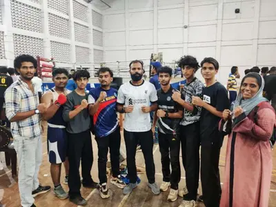 a group of men posing for a picture in a gym at Kaira Regency in Olakara