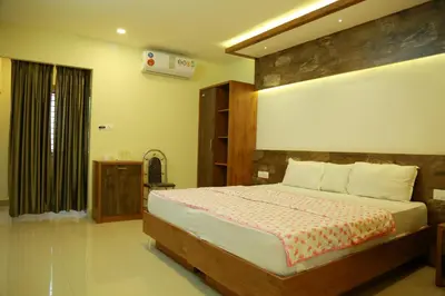 a bedroom with a large bed and a window at Kaira Regency in Olakara