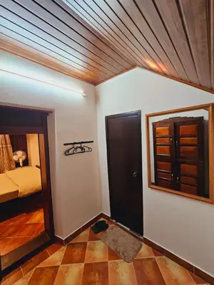 a room with a bed and a ceiling at Moksha The blissful escape in Kaniyāmbetta