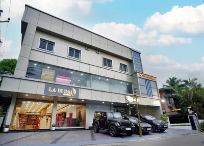 a store with a jeep parked in front of it at UNIVERSAL RESIDENCY in Perumbavoor