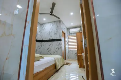 a small room with a bed and a wall at AN REGENCY in Edappāl