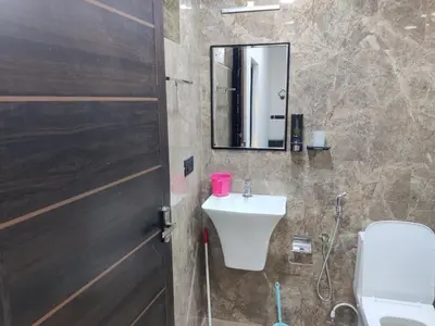 a bathroom with a sink and a mirror at Woodside Haven in Chekadi