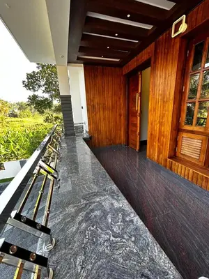 a row of benches sitting outside of a building at Windgram Homestay in Ambalavayal