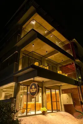 a large building with a sign in front of it at BEL VISTO in Vālpārai