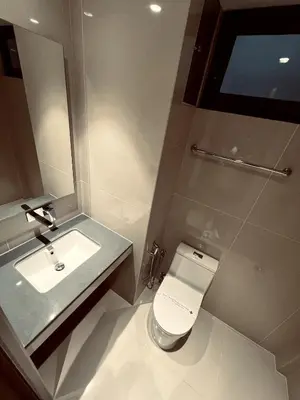 a bathroom with a toilet and a sink at BEL VISTO in Vālpārai