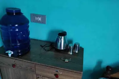 a table with a large blue barrel on top of it at Roof top couple stay cozy in Mysore