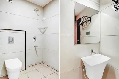 a bathroom with a toilet and a sink at Super Townhouse Mysore Central in Mysore