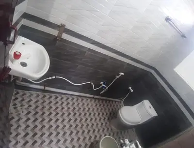 a bathroom with a sink and a toilet at Renu Residency on the way to Isha yoga centre and near Maruthamalai in Marudhamalai
