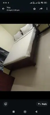 a picture of a bed in a room at Renu Residency near Maruthamalai and on the way to Adiyogi Isha yoga Centre in Marudhamalai