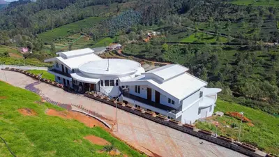 an aerial view of a house on a hill at COASTAL GRAND RESORT - KOTAGIRI in Kotagiri